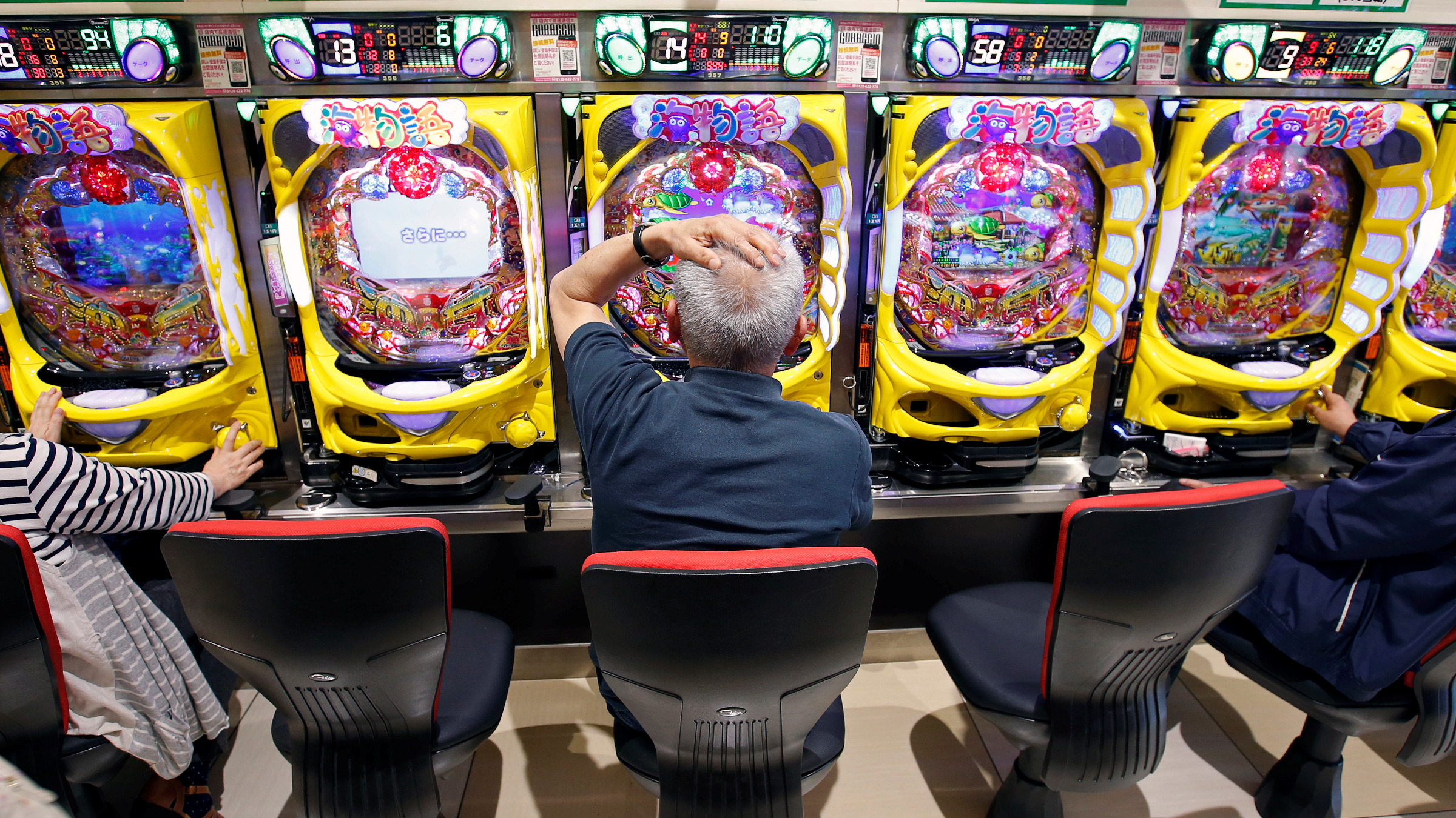 visitors-play-pachinko-a-japanese-form-of-legal-gambling-at-a-pachinko-parlour-in-fukushima
